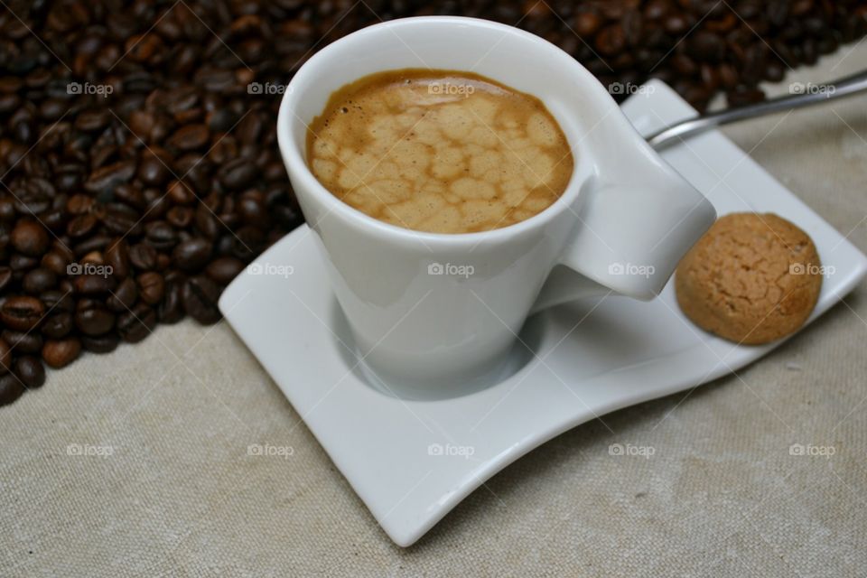Coffee and amaretti with coffee beans