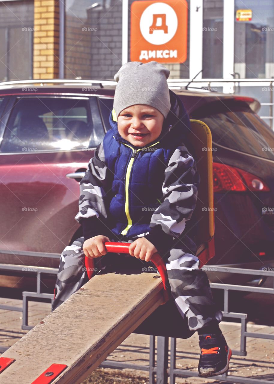 joyful child walks on the playground