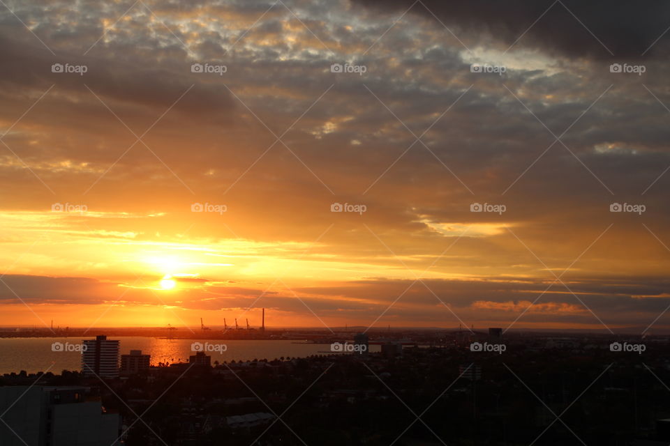 The bold, bright sun setting over the city of Melbourne 
