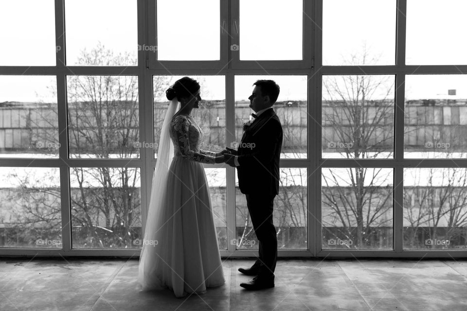Wedding photo session in a studio with panoramic windows
