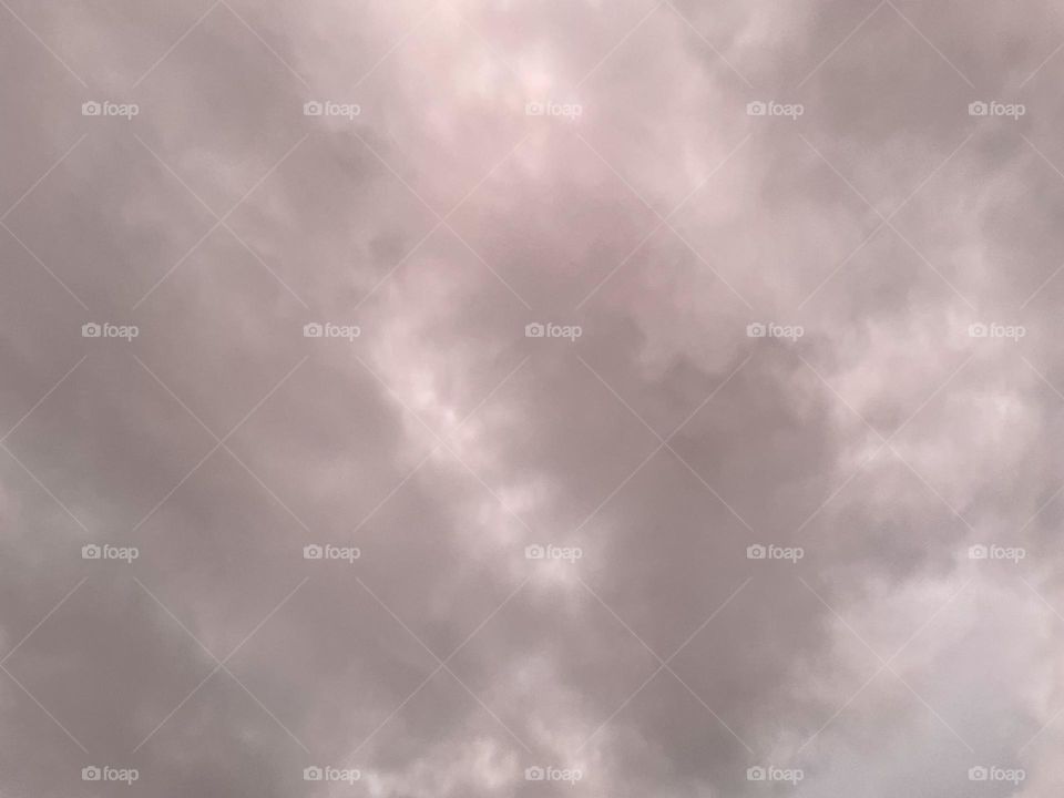 Clouds that are tinted pink. 