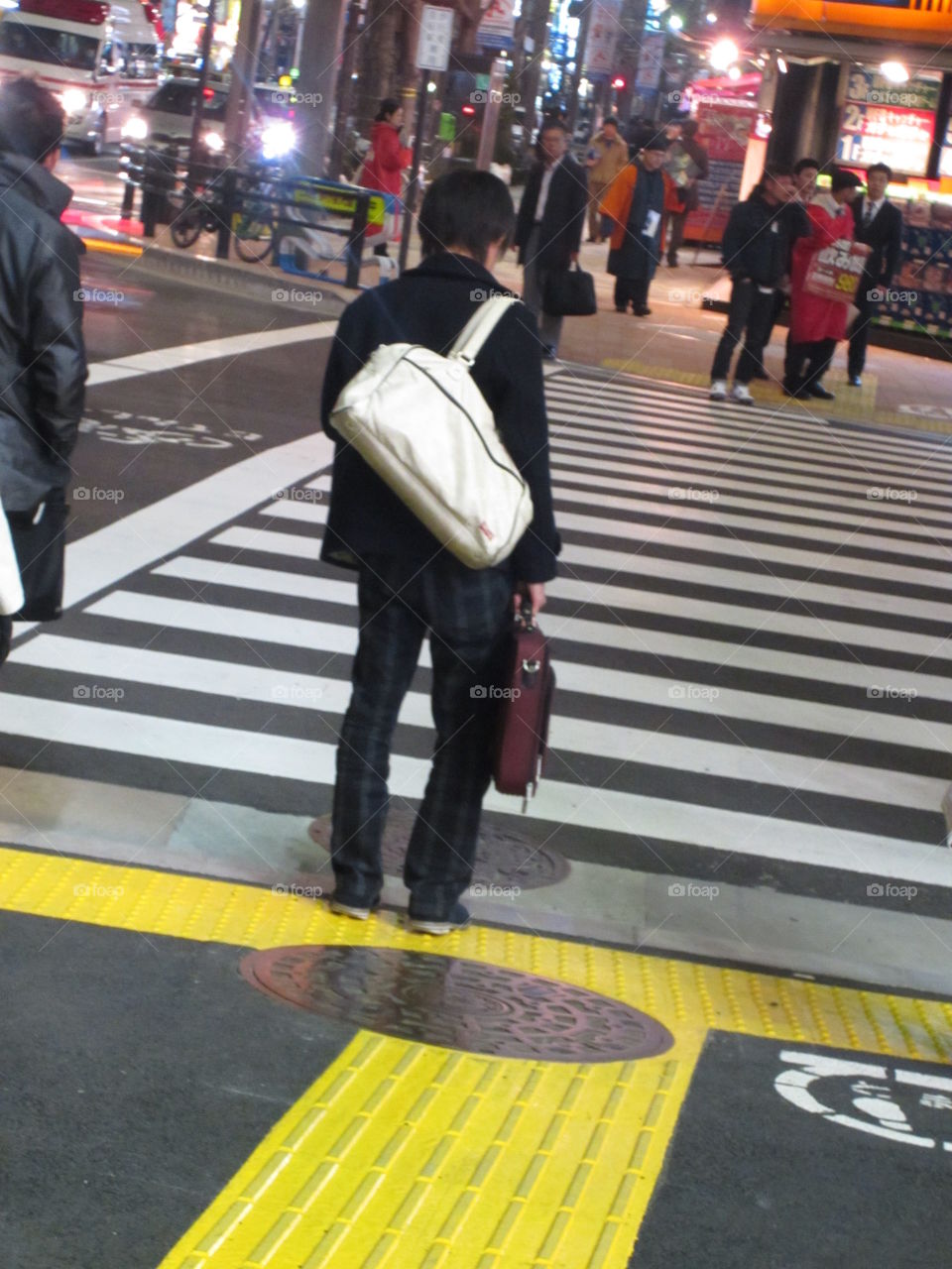 Akihabara, Tokyo Street Crossing, Night View of People. Businessman with briefcase.