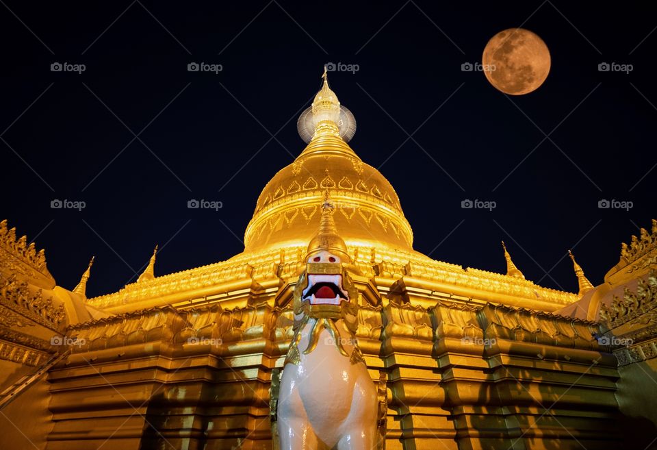 Golden night , Beautiful full moon light over Maha Wizaya Pagoda in Rangoon Myanmar