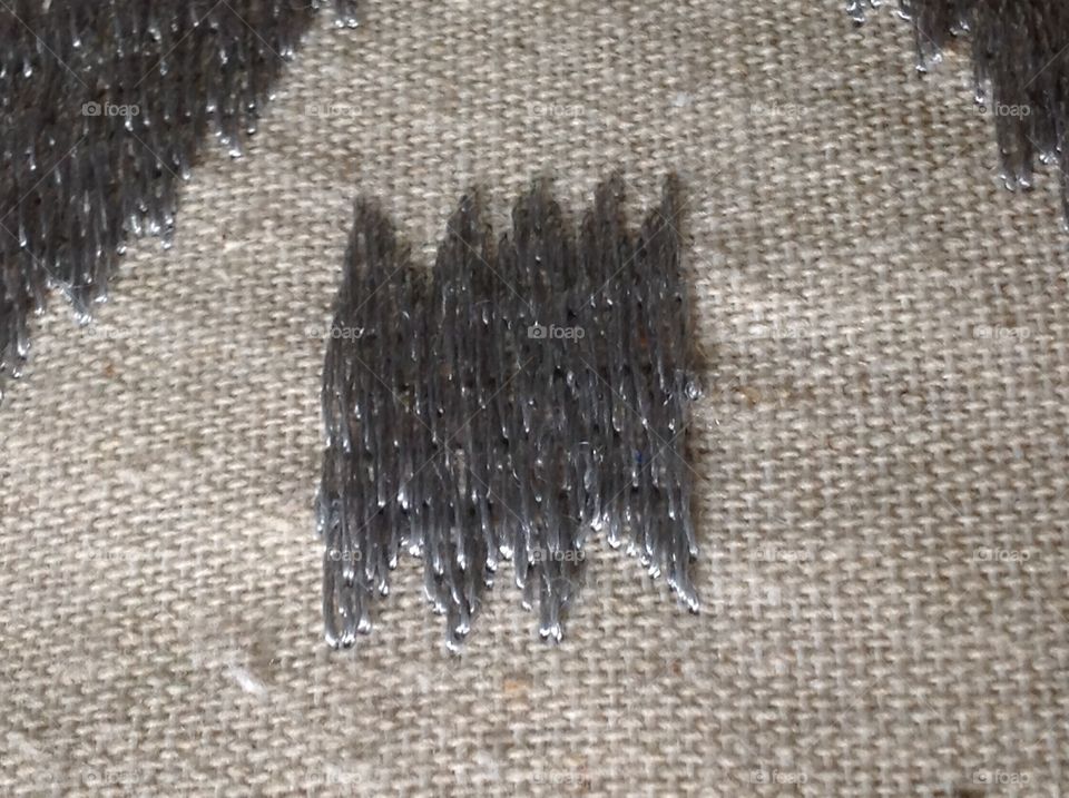 Threads on a fabric pillow