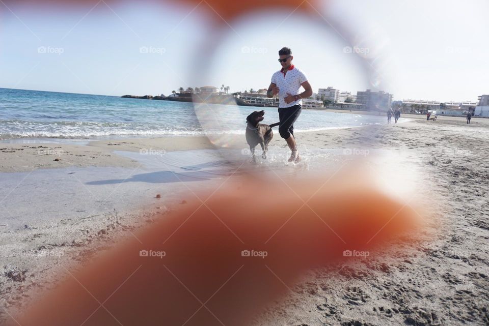 Beach#sea#human#dog