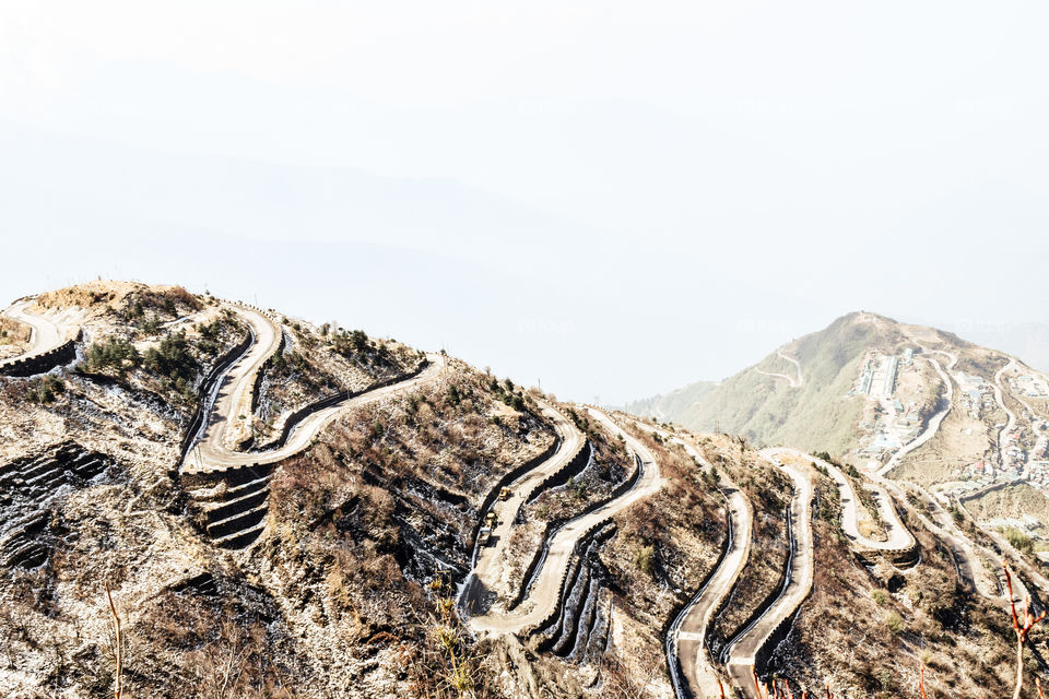 Rugged terrain of lower Himalayas in East Sikkim, Zuluk or Dzuluk, from Thambi View Point. Winding road of 32 hairpin turns. Historic Silk Route from Tibet to India. Offbeat destination in East Sikkim