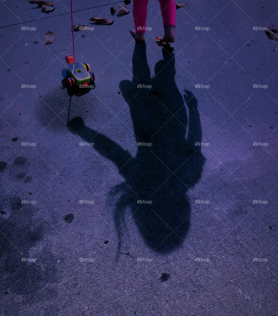 Girl playing with tortoise toy