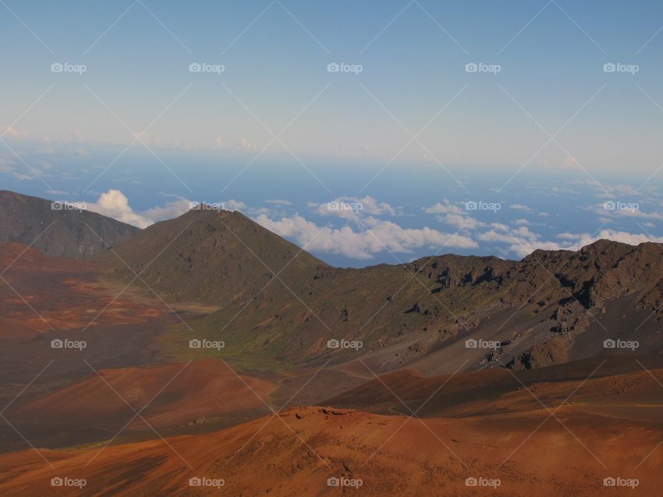 Scenic view of mountains against blue sky