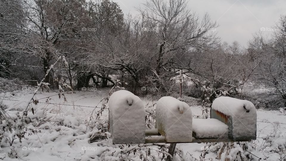 Snow covered mailboxes, a homey feeling,excitement of what might be arriving.