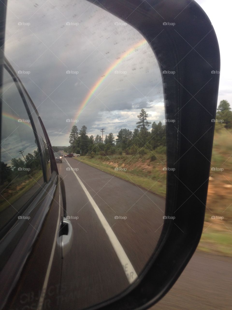 Rainbow in the rear view . In the rear view mirror. Heber az