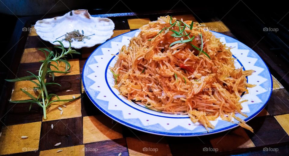 Vermicelli with tomato sauce in plate