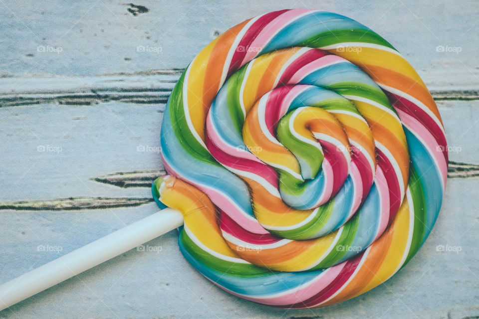 Close-up shot of rainbow lollipop