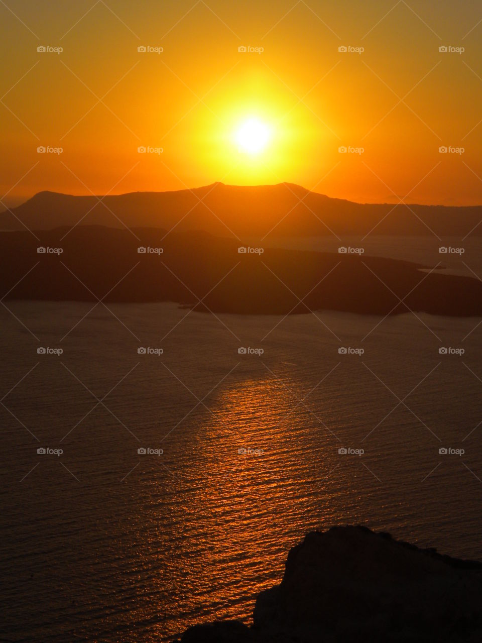 Sunrays, Santorini, Greece.