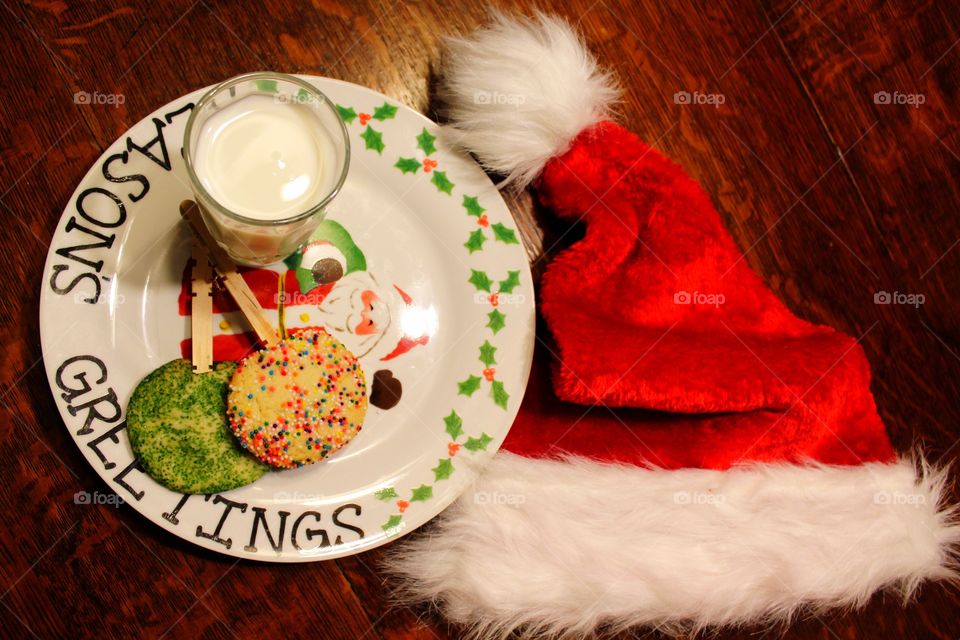 Flat lay of milk and cookies for Santa Claus 