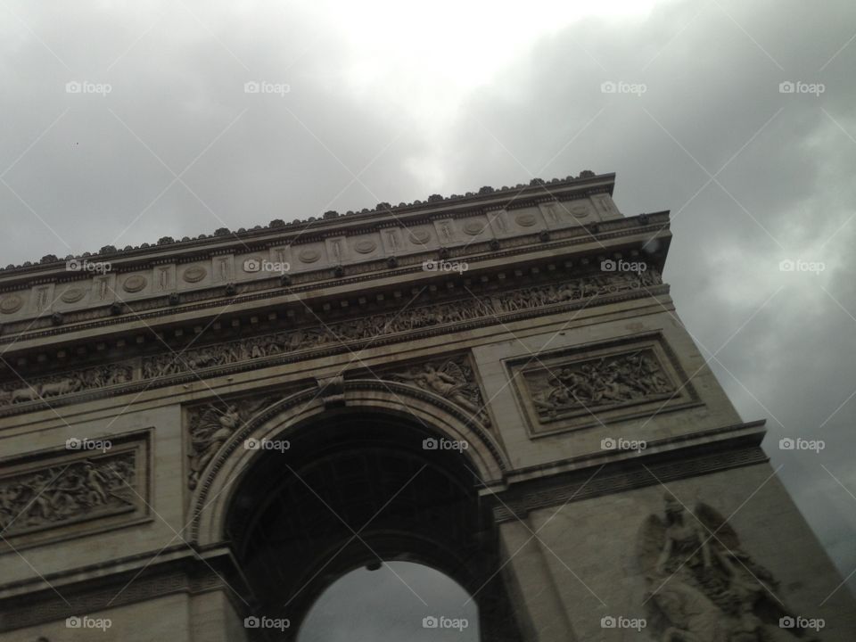 Looking up at the Arc de Triomphe monument in Paris 