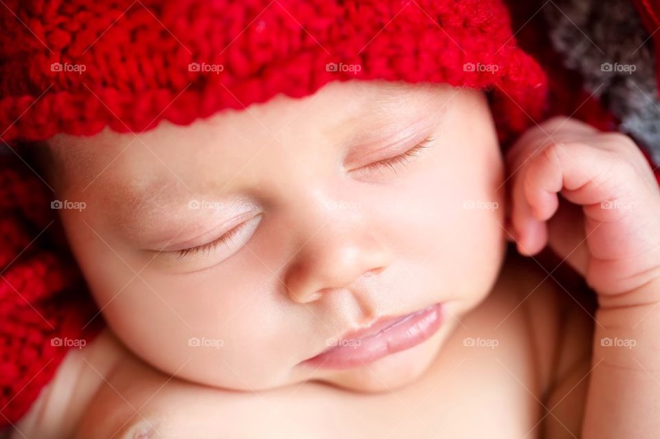 Cute infant in red hat