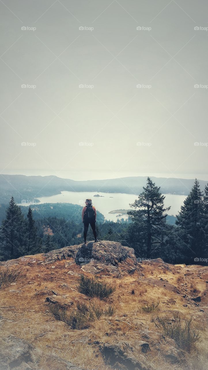 Person taking in the beautiful mountain views.