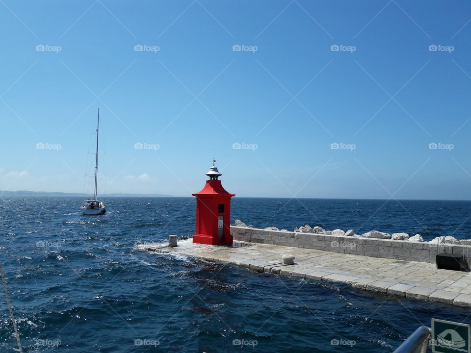sailboat sea lighthouse