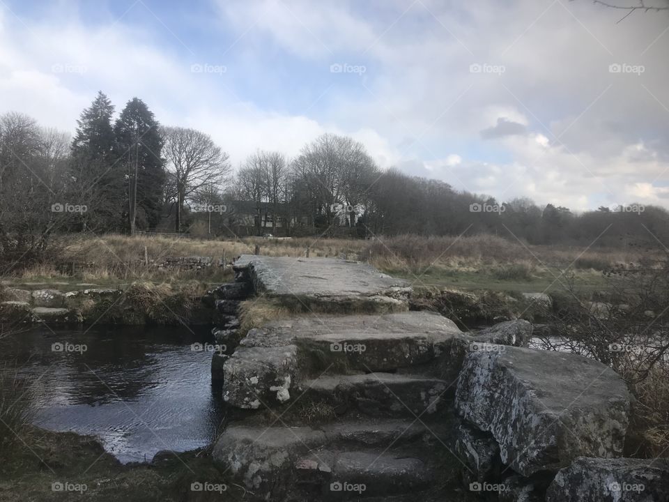 Steps to and bridge of Postbridge on a freezing winters day on Dartmoor in Devon.