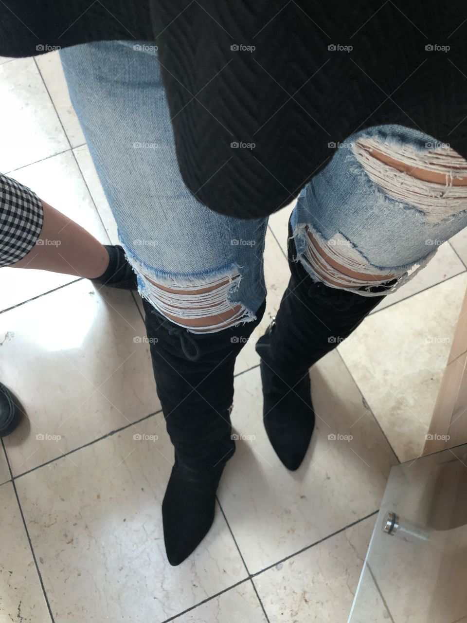 Boots and ripped jeans 
