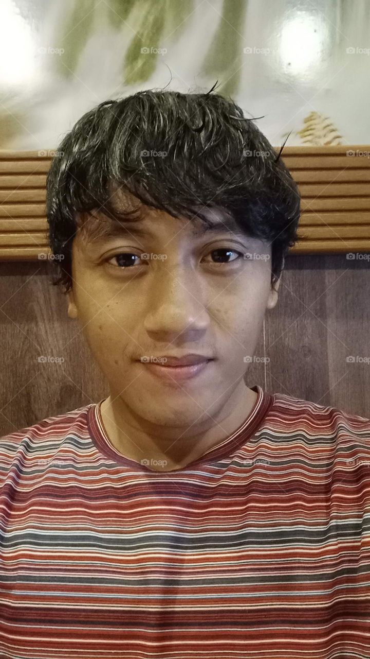 Portrait of a man with messy hair