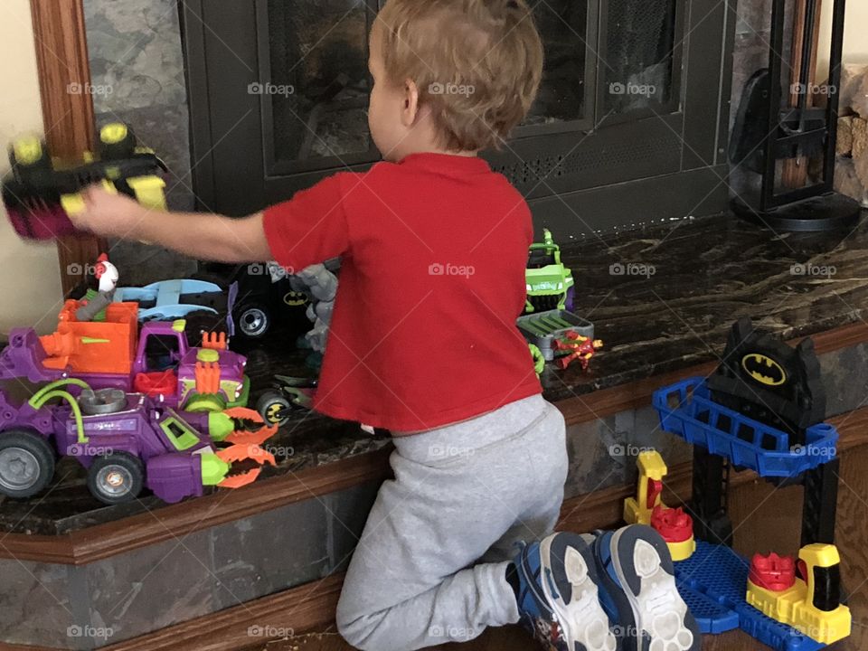 Boy plays with toys