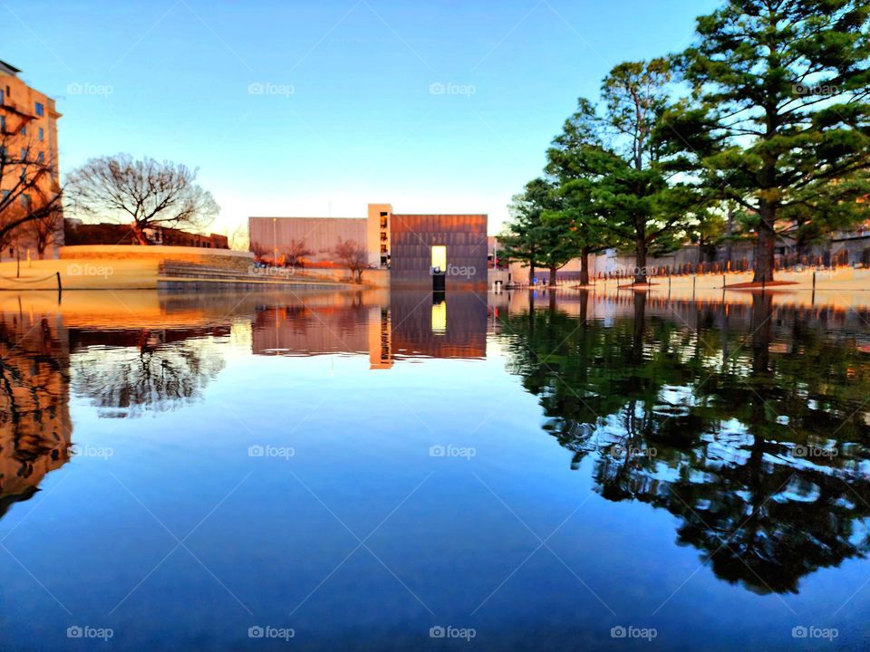 A reflecting pool at a memorial park creates a mirror image on a cool Spring night