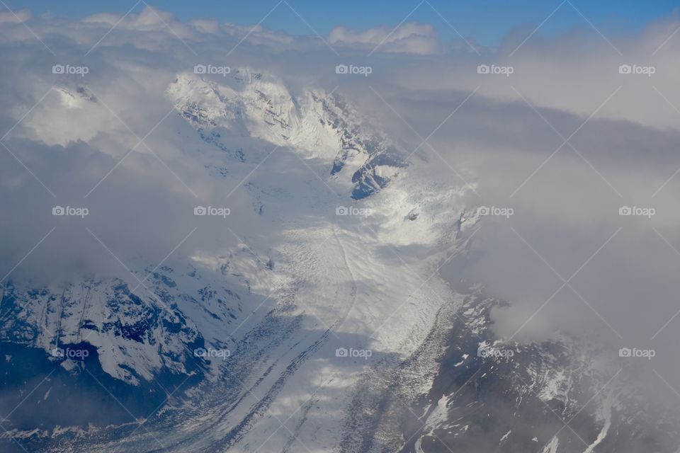 Mountain Clouds And Glacier 