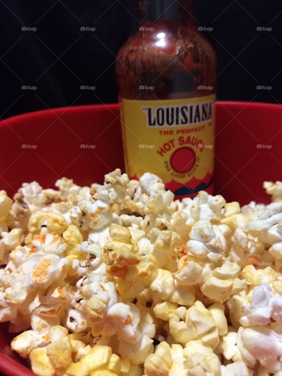 Louisiana hot sauce and popcorn one drop