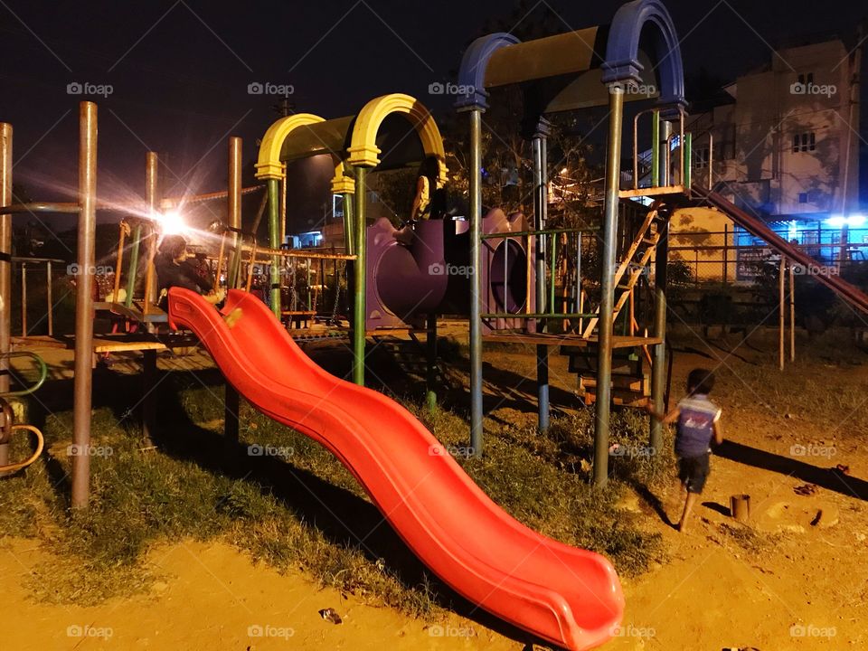 Children park in night. When everybody has left the place, my daughter is still insisting me to be here and play. 