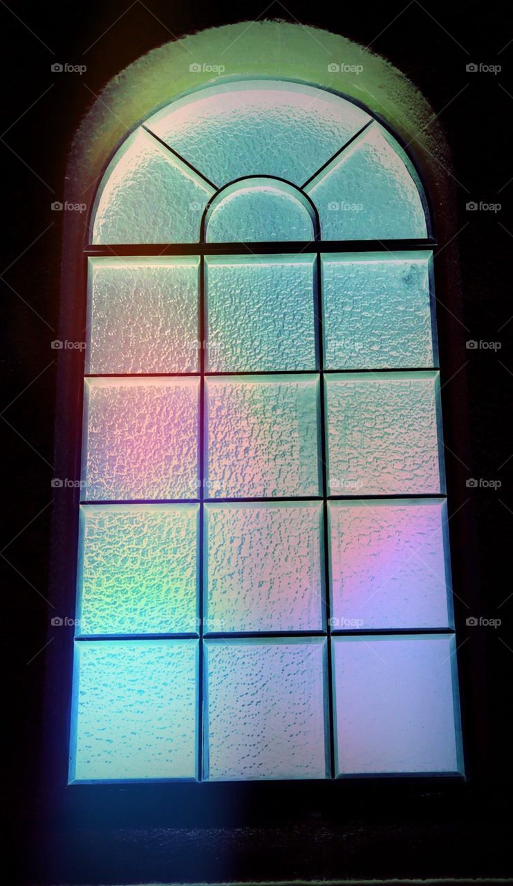 Antique Window. Antique Window reflecting the colors outside.
