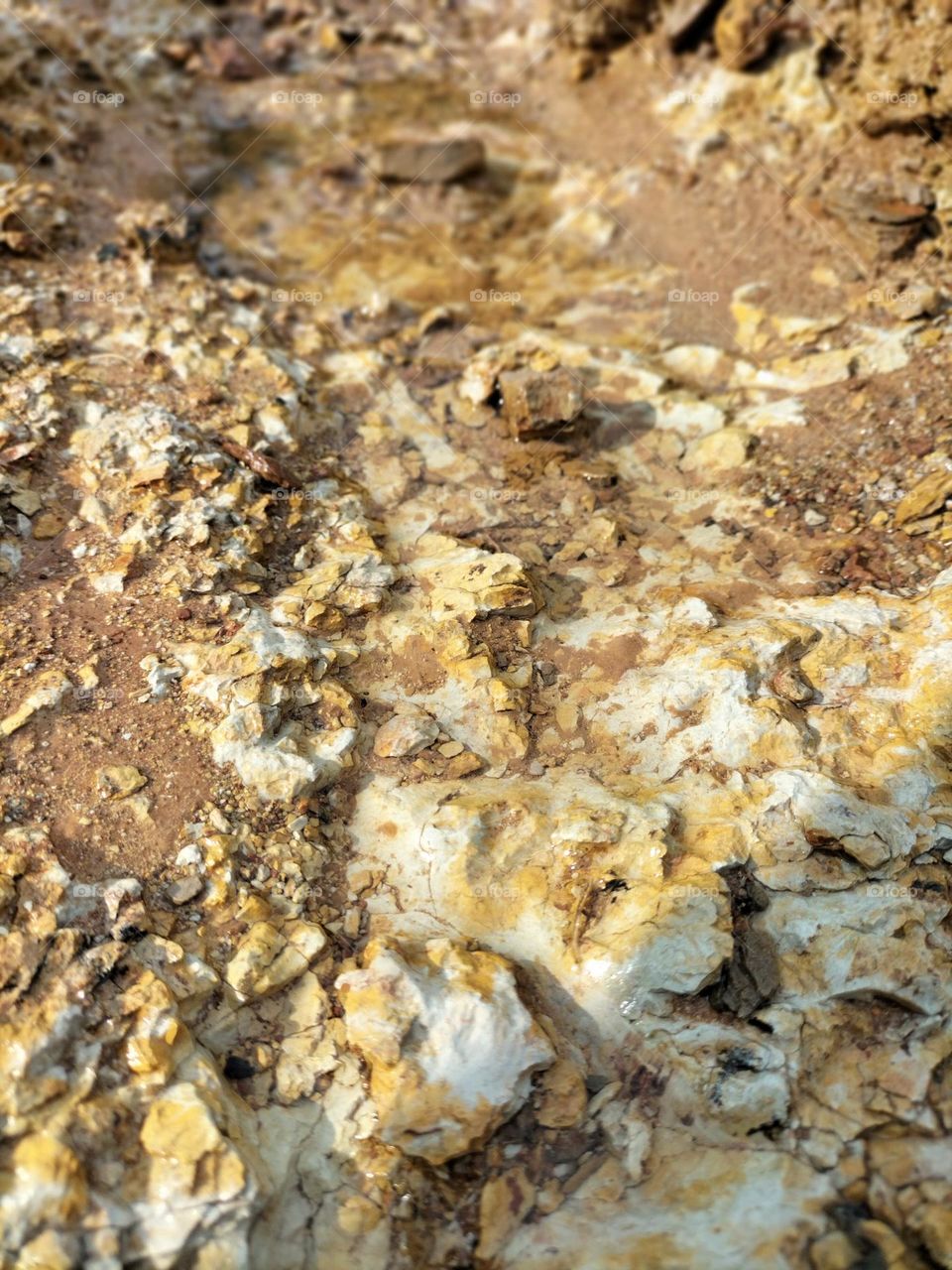 texture of water-eroded rocks and clay
