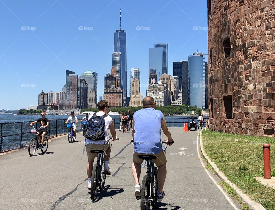 People biking on Governors Island on a summer day