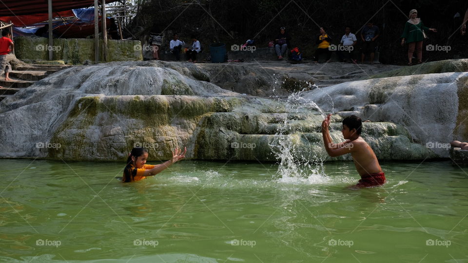 Therapy for Gunung Kapur sulfur hot spring bath in Ciseeng Village, Bogor, West Java, Indonesia