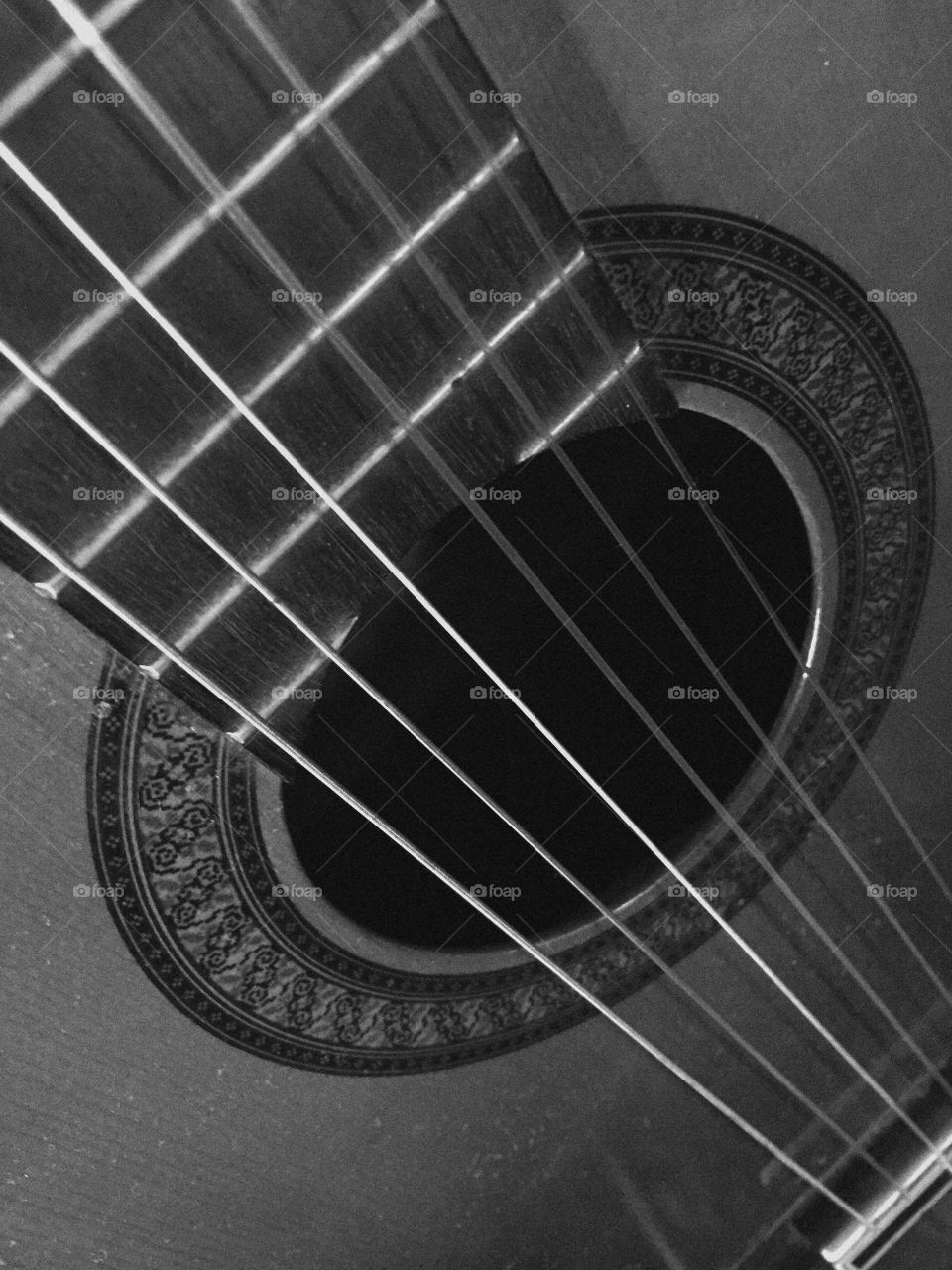 Macro Black and white of a guitar