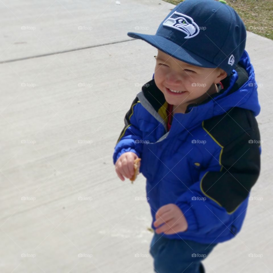 Happiness. feeding ducks and the last piece of bread just got gobbled by a huge swan
