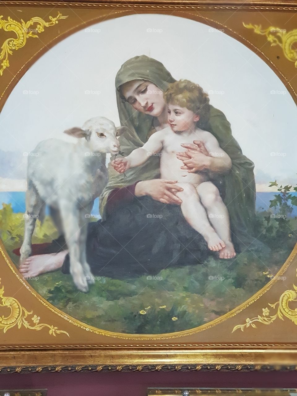 Painting a woman carrying a baby