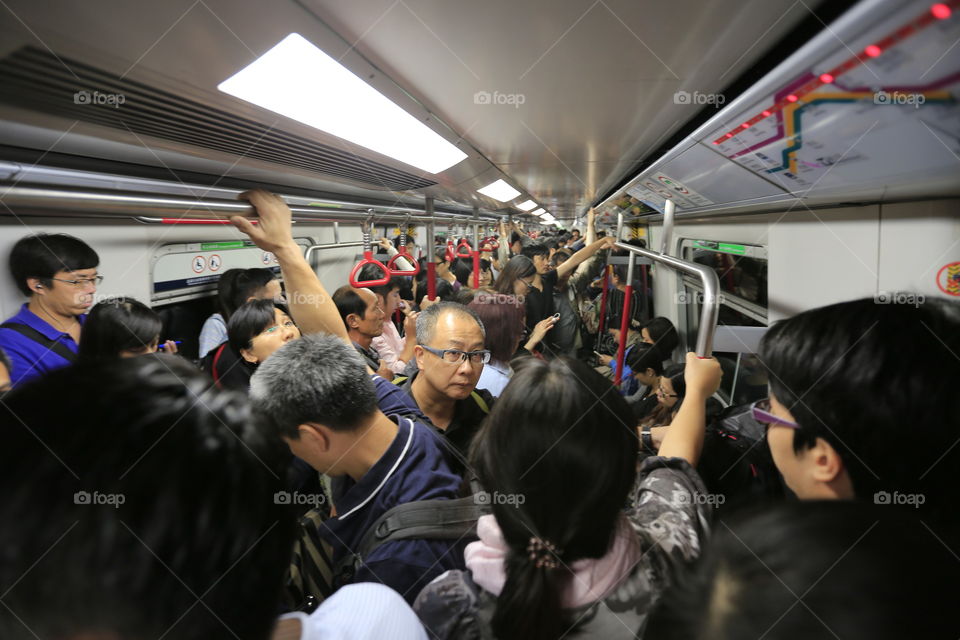 Packed MTR. People crammed into one of Hong Kong's trains