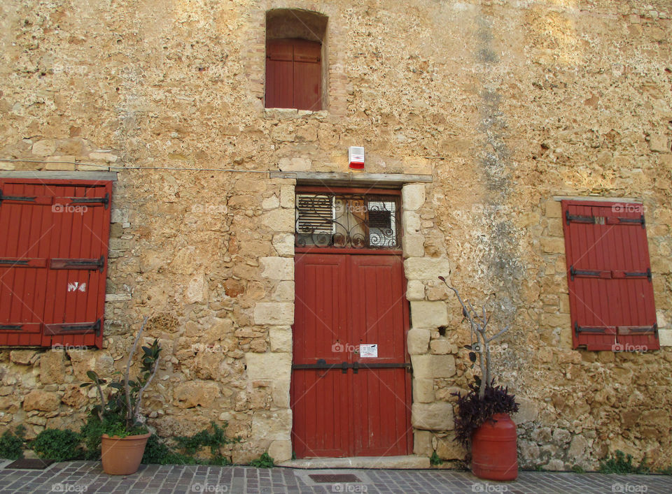 Vintage Style Red Door and Windows of an Old Building in Chania, Crete Island of Greece