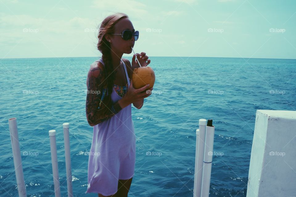 Girl drinking coconut water