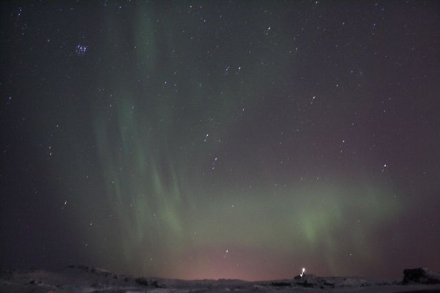 Exploring the nature. Northern lights during the night. Outdoors adventure.