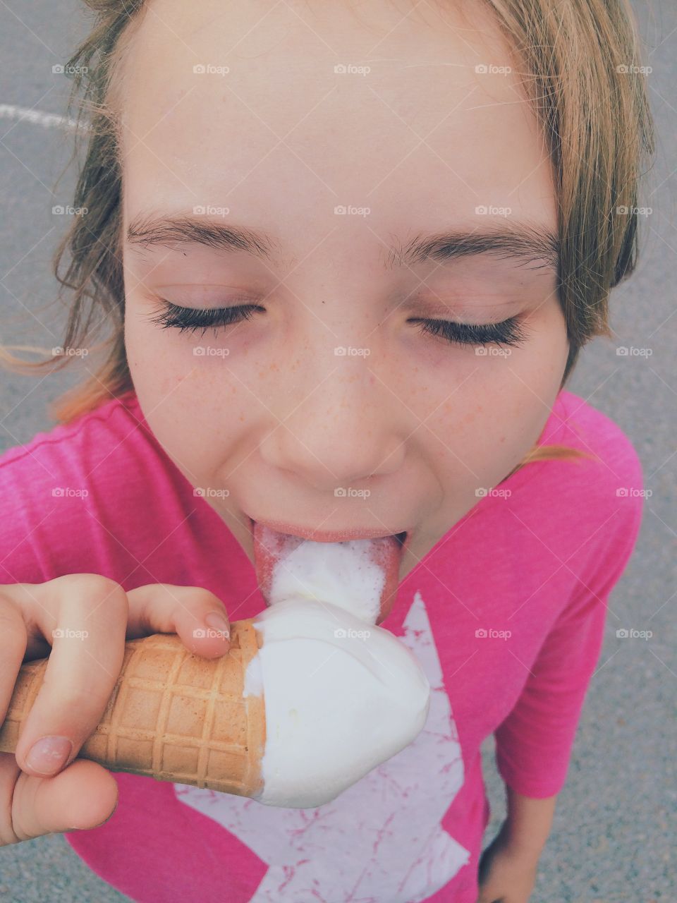 Tasty. Girl eating ice cream