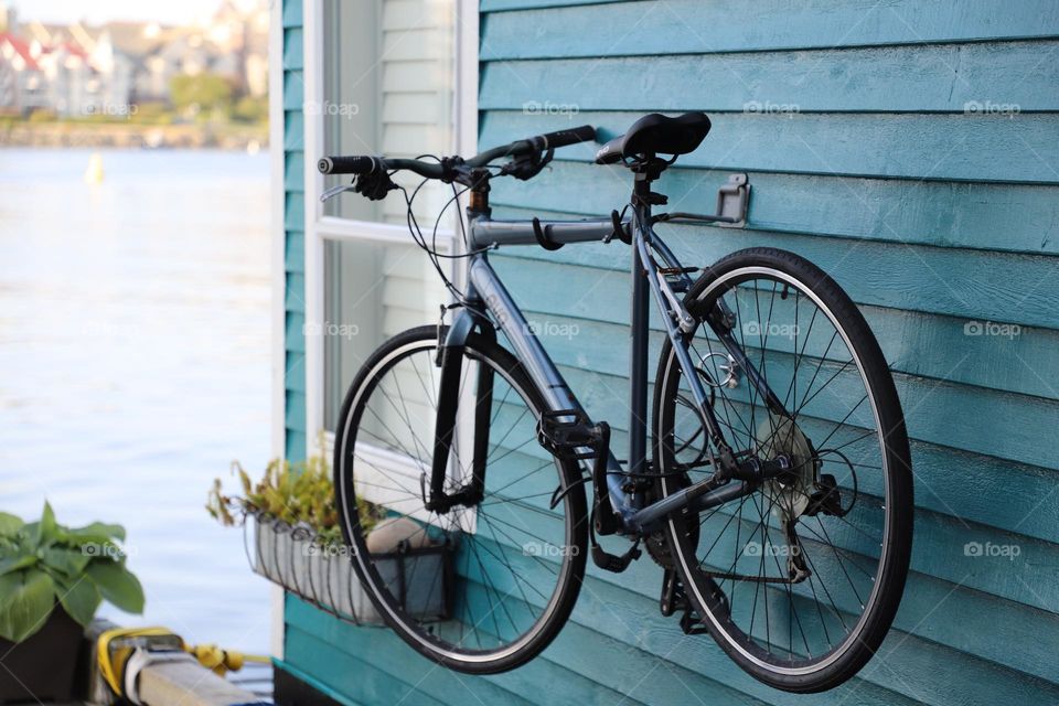 Bike hanged on outside wall