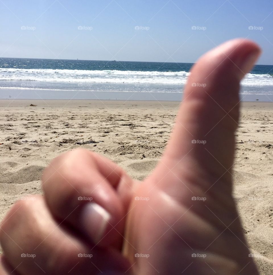 It's the smell of suntan lotion , the sound of the surf, and the sounds of children building a sandcastle. Thumbs up!