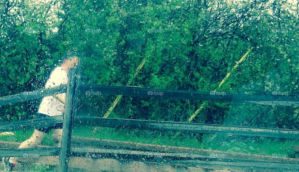 Just Running in the Rain. Man jogging through rain storm