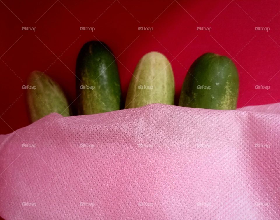 Cucumbers in pink shoping bag
