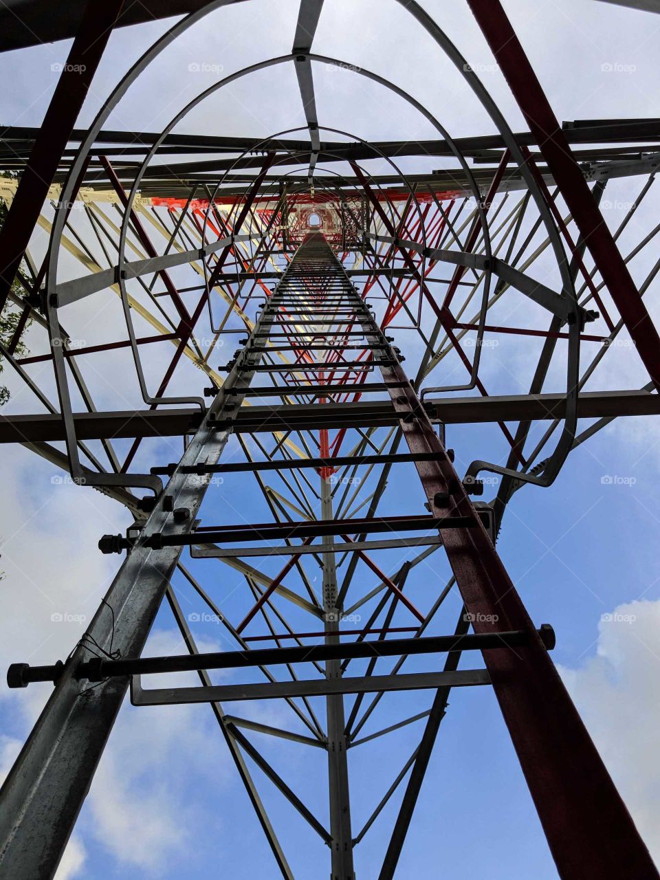 the view to the top from the bottom of a cell tower. this shows how tall the structure is.
