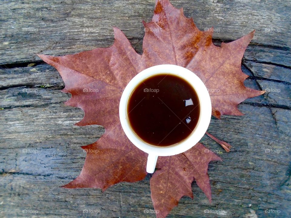 Coffee on a autumn leaf