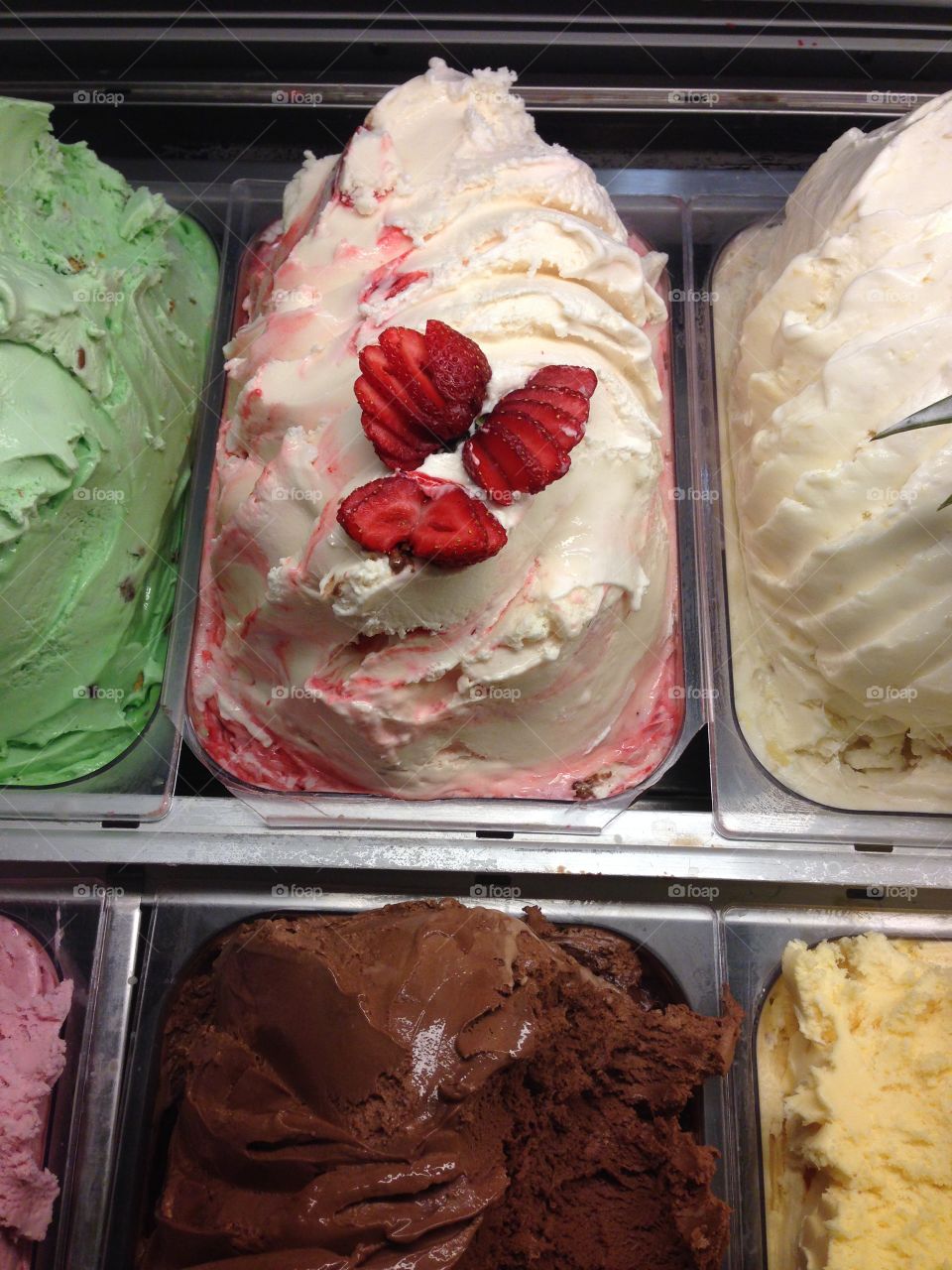 Italian gelato on store displa. Italian gelato displayed in ice cream shop store