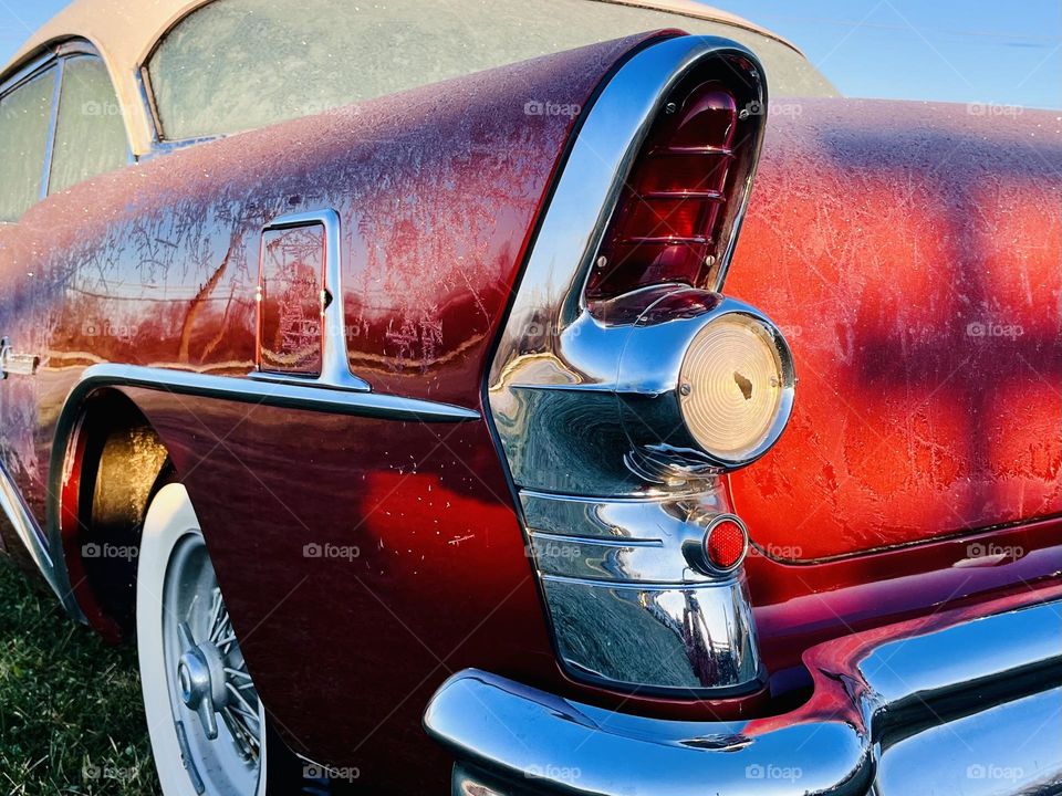 The first light of dawn shines over the Shenandoah Mountain range onto a Century Buick at the roadside of Route 340 in Grottos, Virginia. 